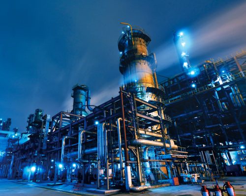 Oil Refinery, Chemical & Petrochemical plant abstract at night.